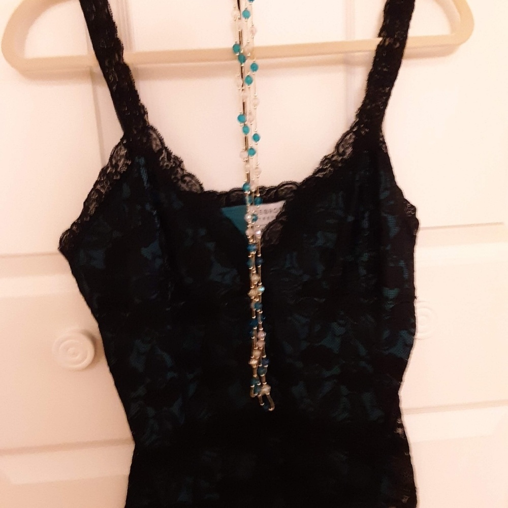 Black lace outer top with a green teal liner.